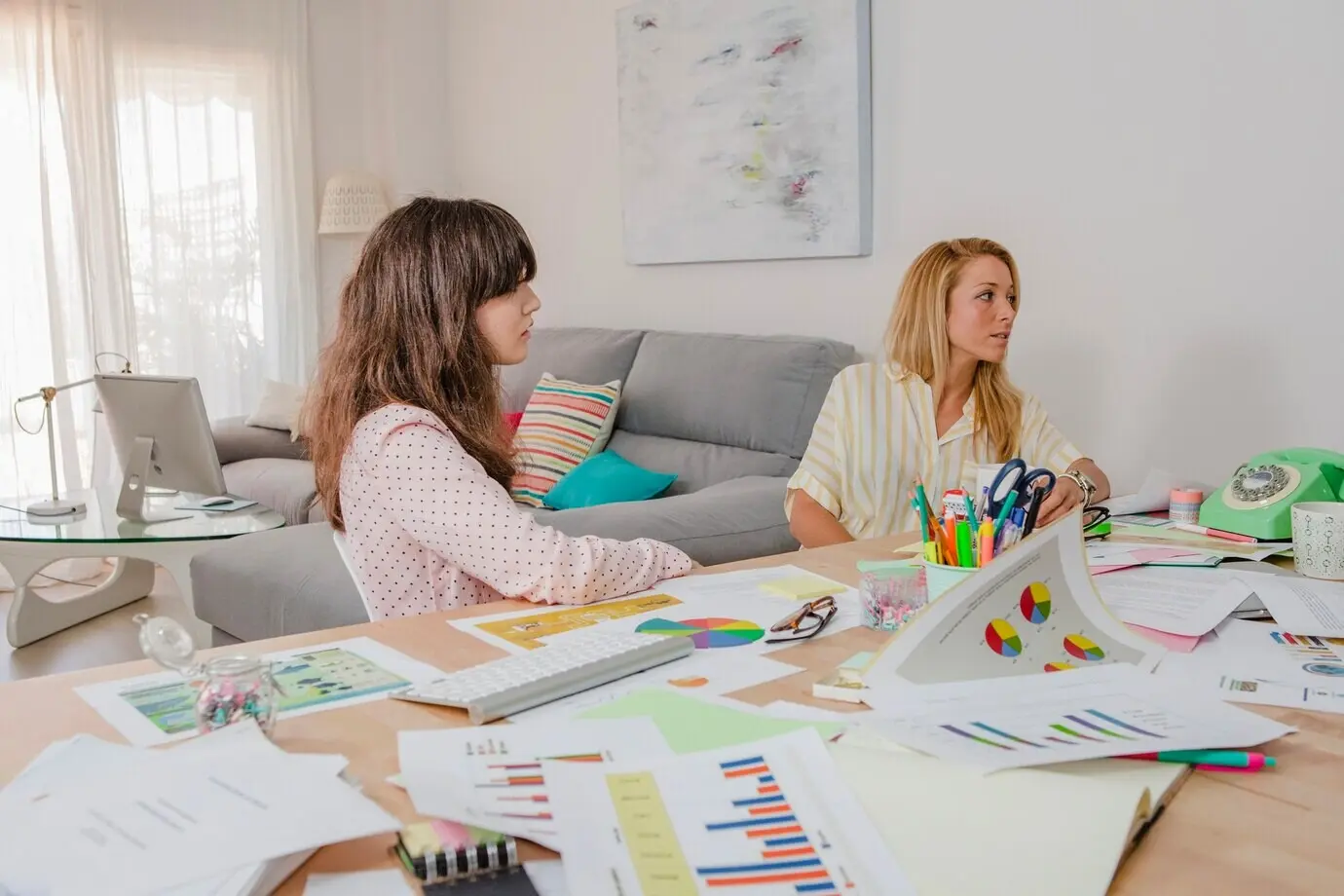 Women seated at a meeting