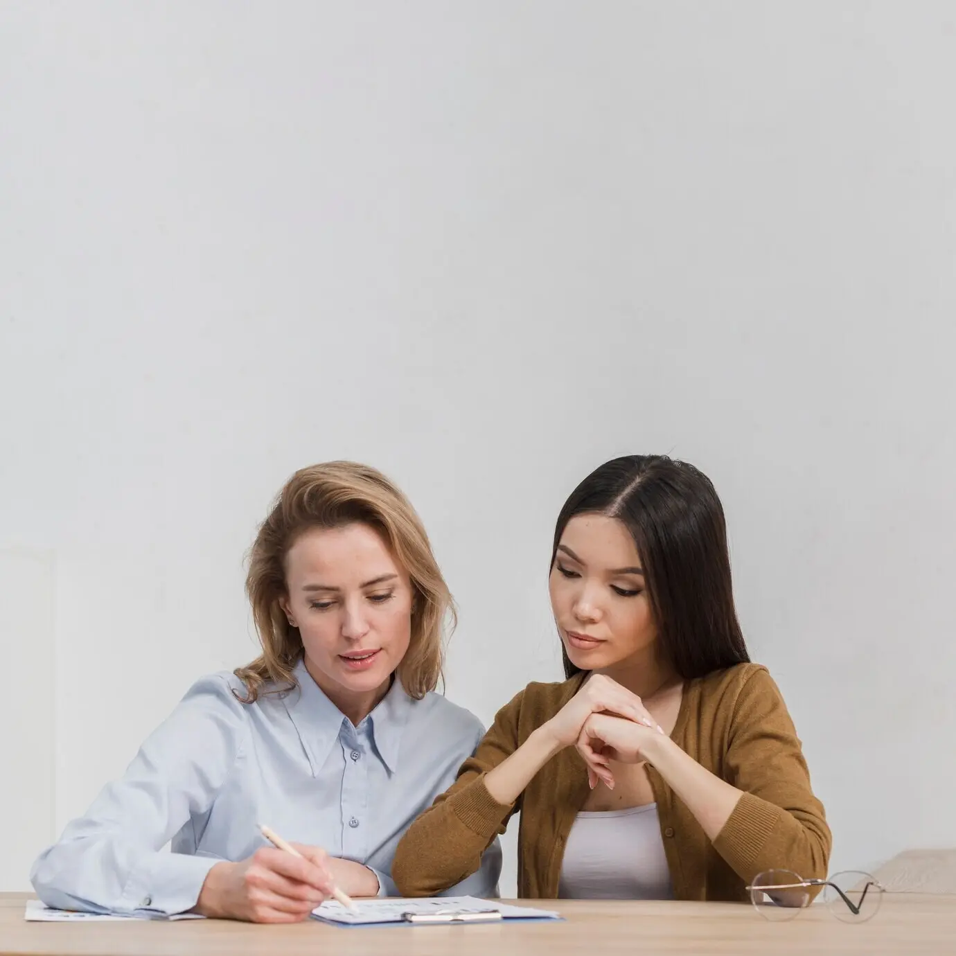 A portrait showing beautiful women making plans.