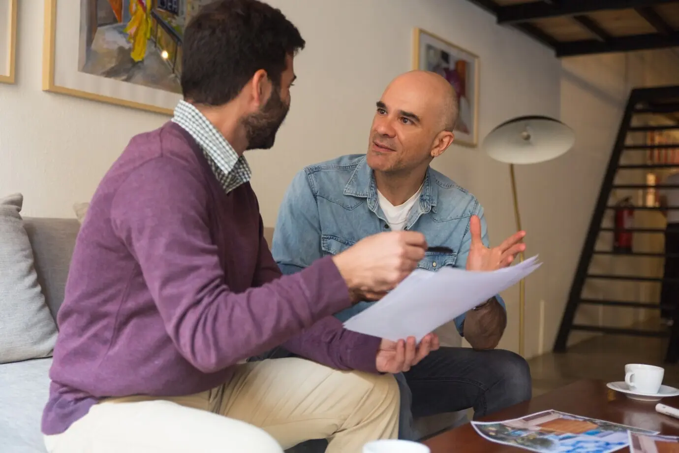 An interior designer and a homeowner discuss renovation ideas.